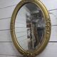 Miroir ovale style Louis XV doré miroir biseauté
