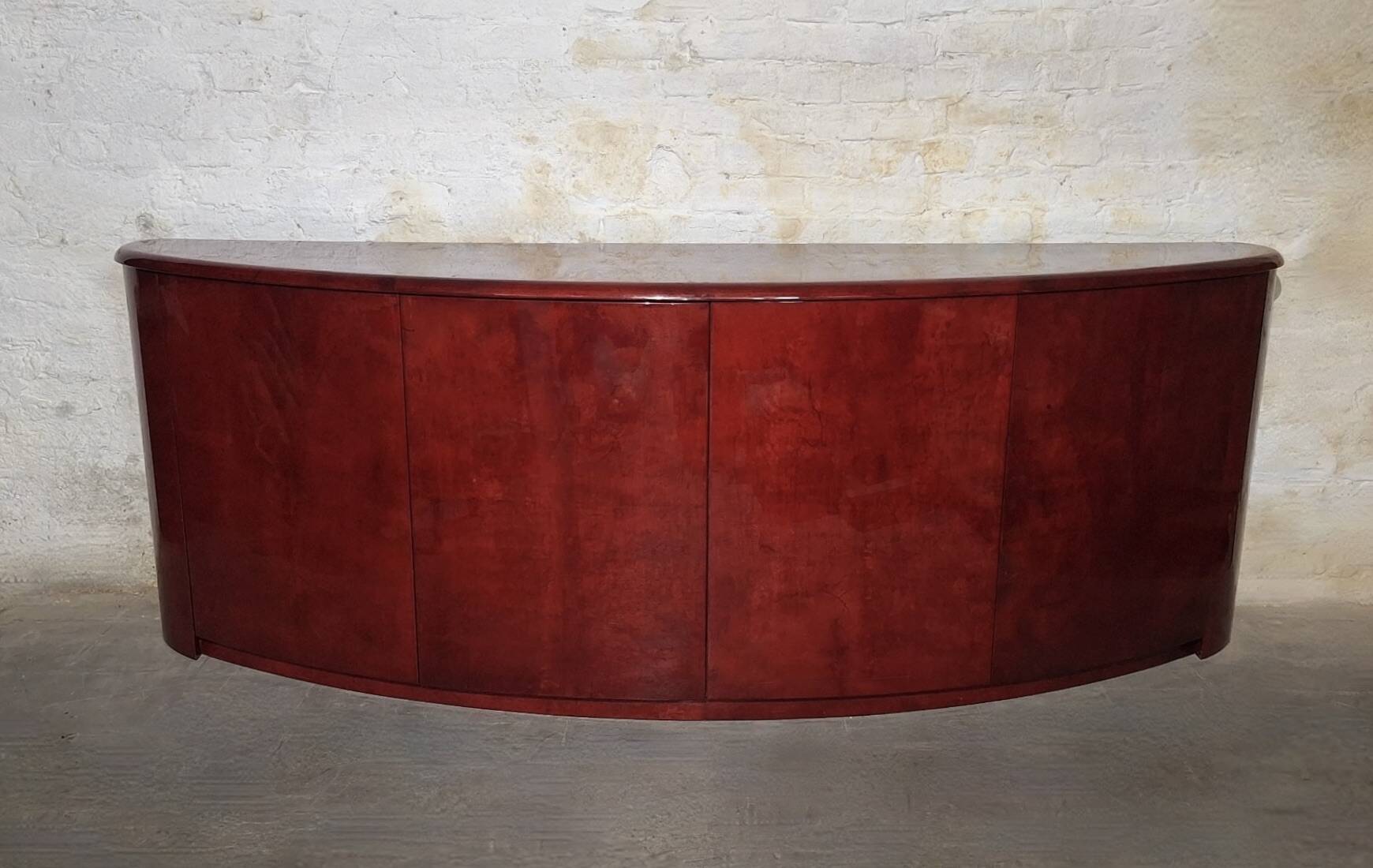 Italian convex sideboard in lacquered parchment by Aldo Tura