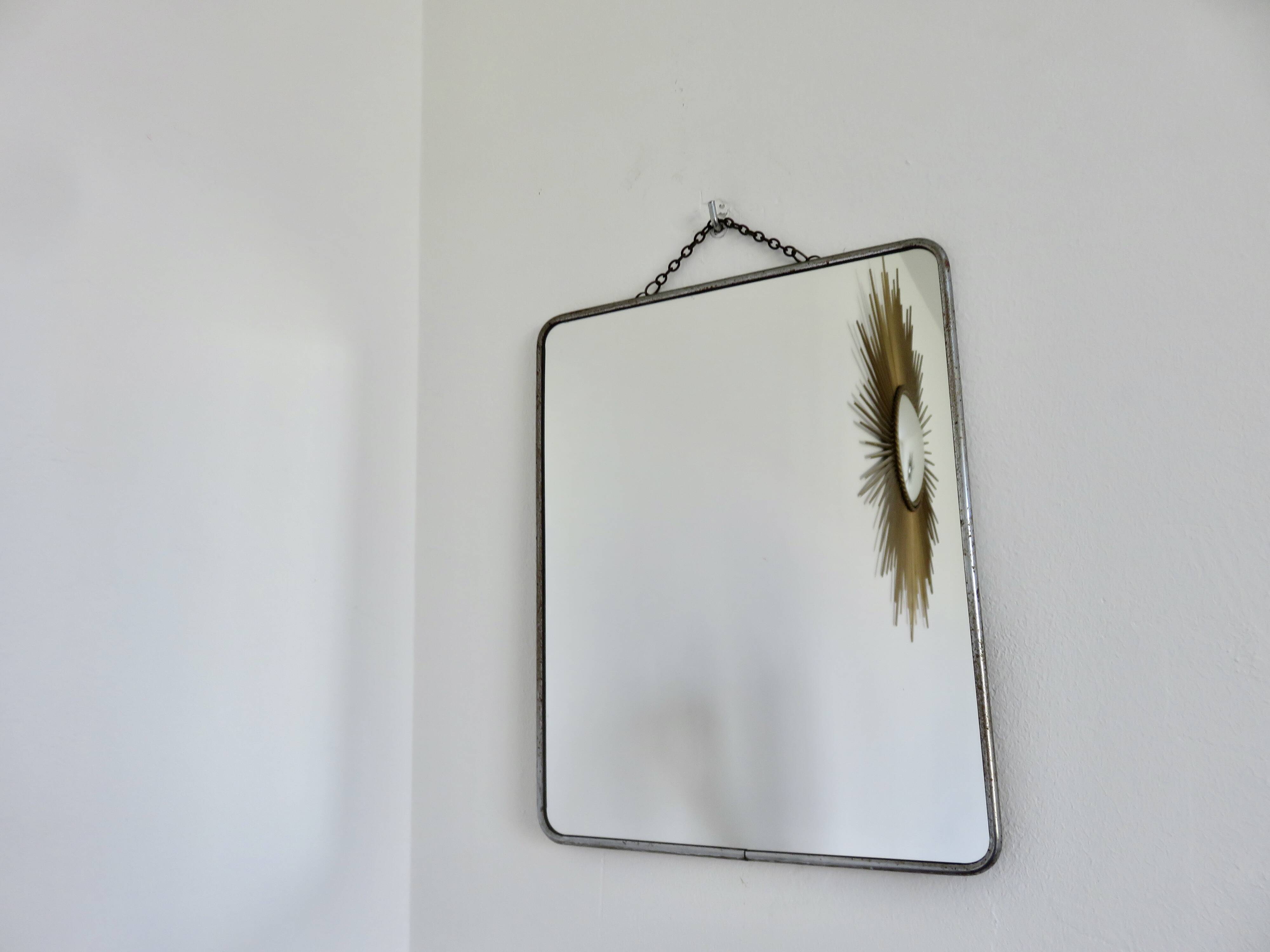 Old barber's mirror with chain, 1950s and 1960s