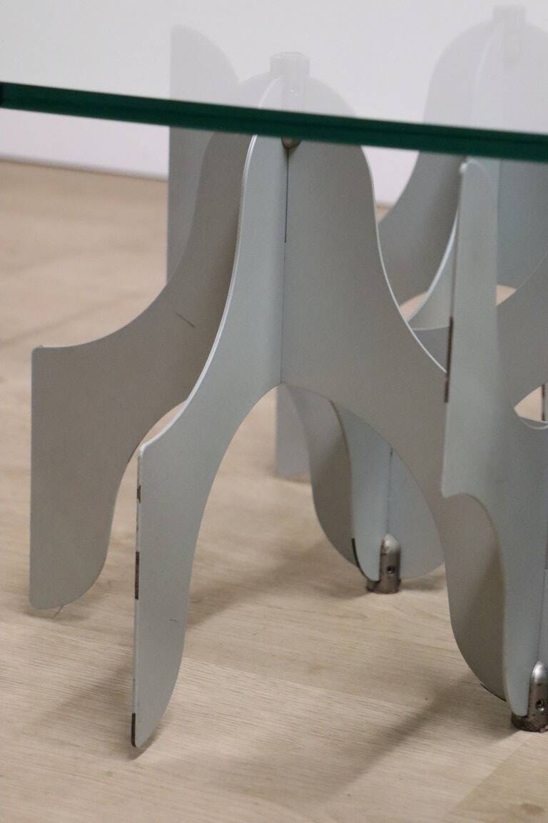 Minimalist sculptural coffee table in metal and glass