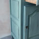 Small vintage side table in sage green patina and solid wood.