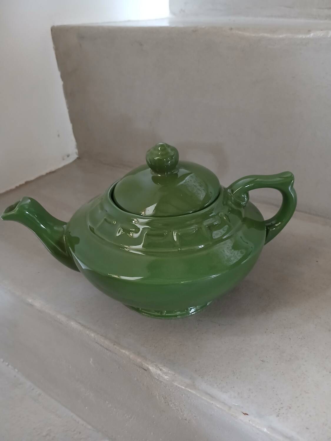 Green earthenware teapot
