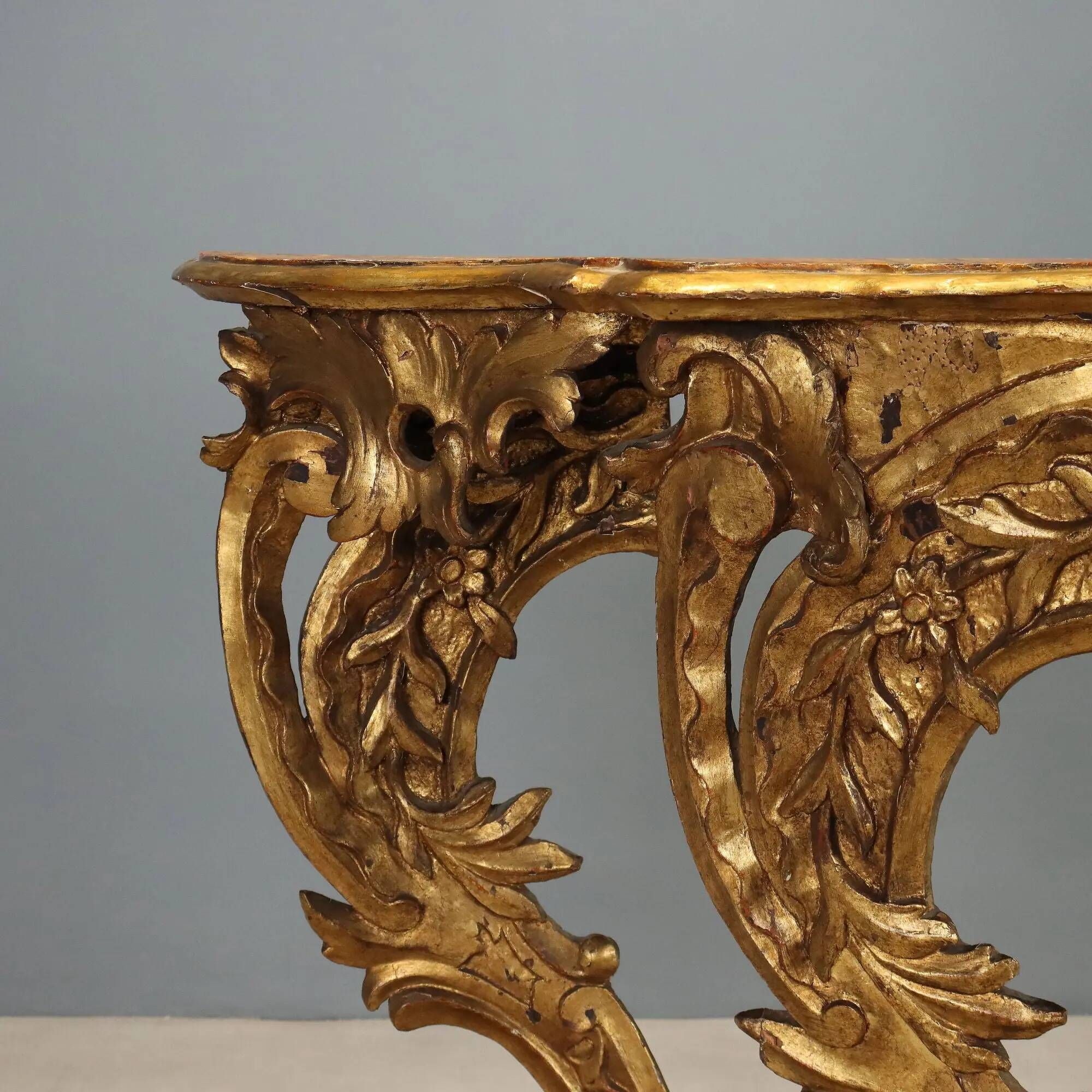 Old eclectic console carved in gilded fir, Italy 19th century