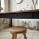Oak farmhouse table with turned black legs.