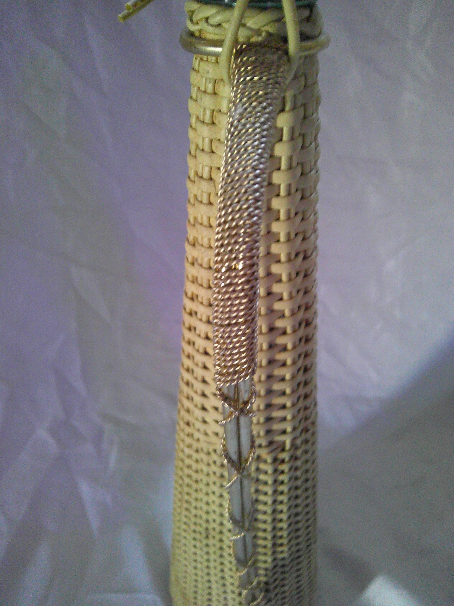 Old glass bottle - Woven wicker