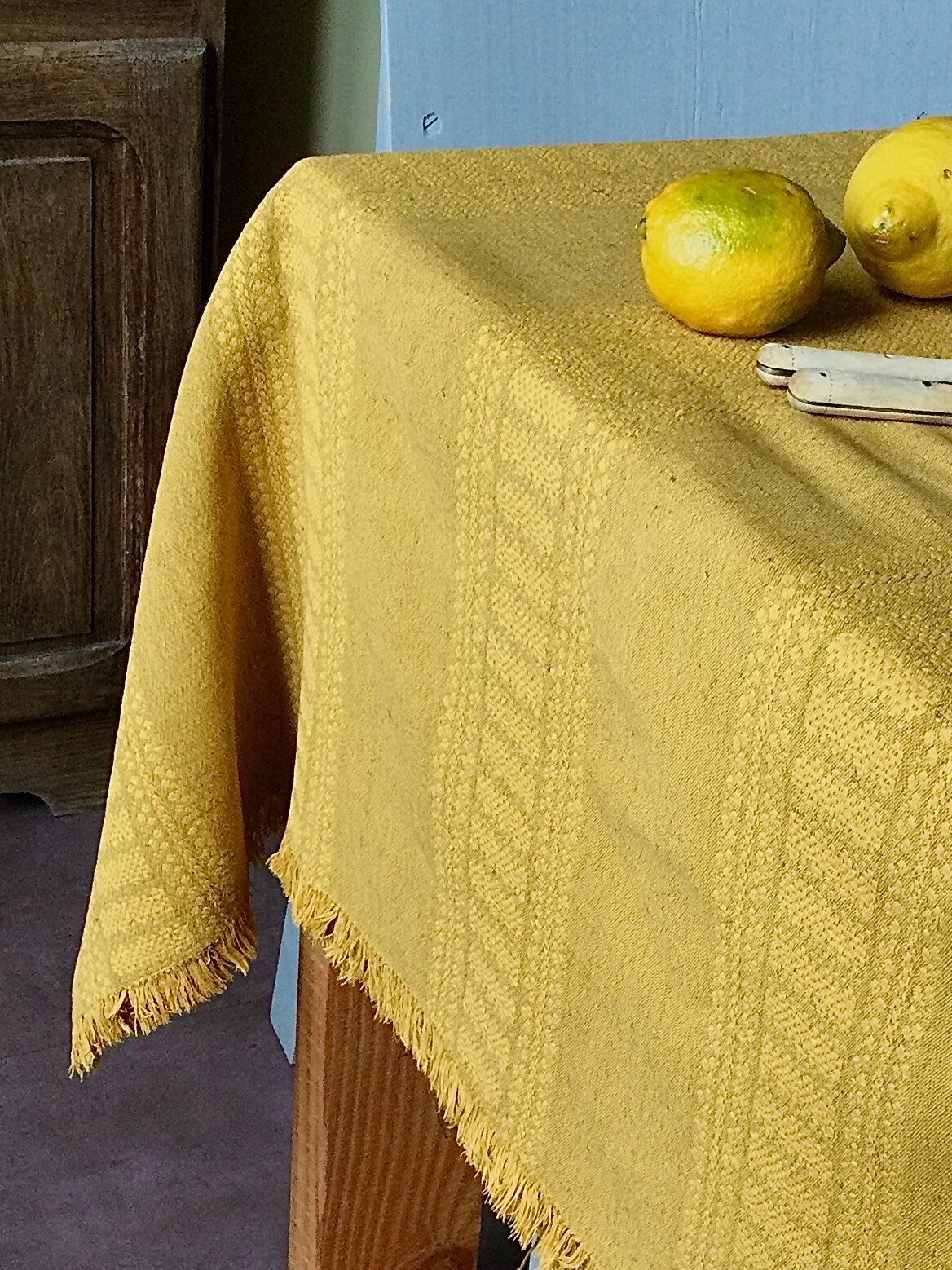 Old damask tablecloth tinted curry yellow