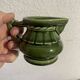 Green ceramic milk jug