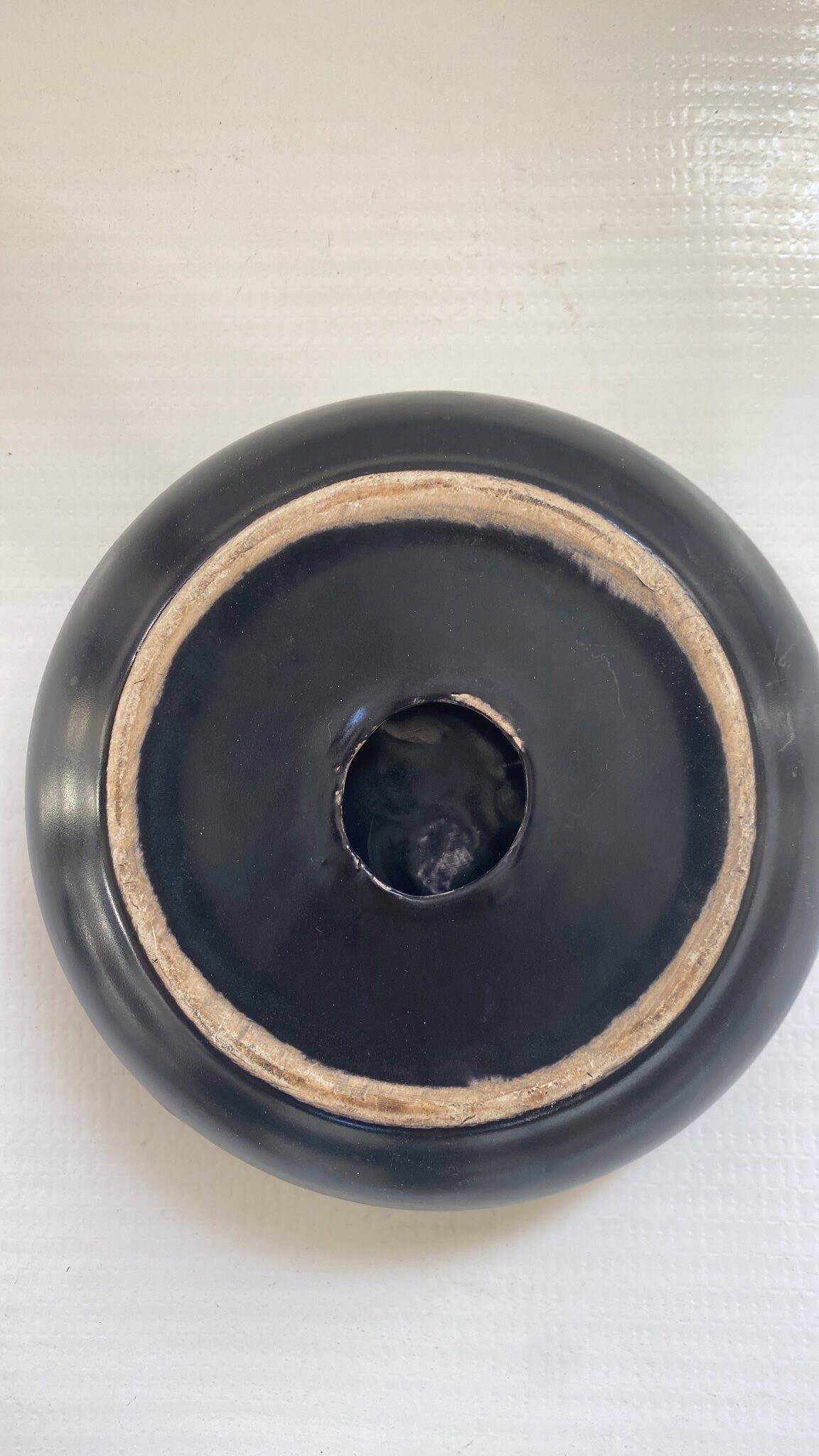 Black ceramic ashtray from the 1950s