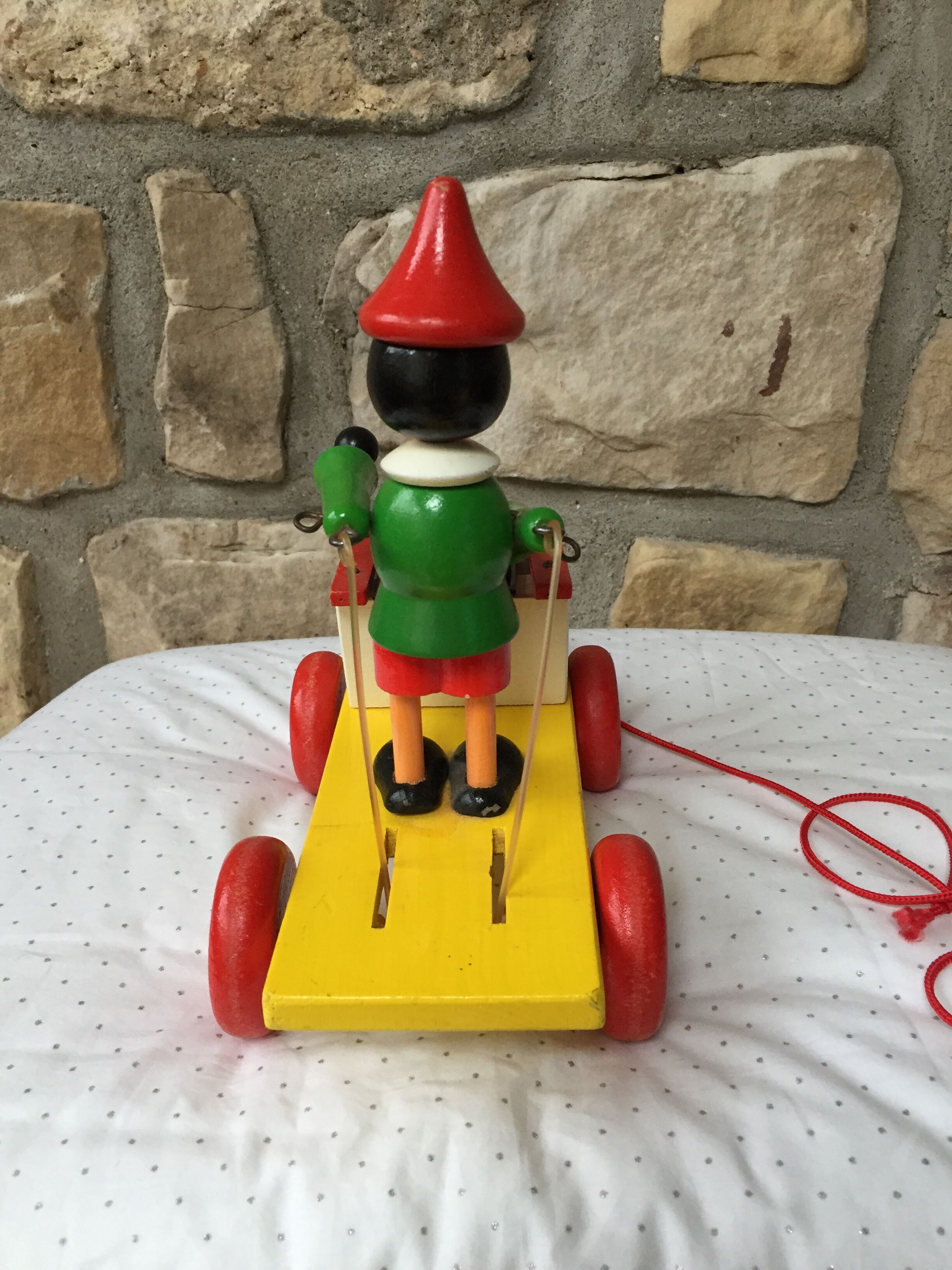 Old toy to pull Pinocchio and his xylophone