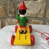 Old toy to pull Pinocchio and his xylophone