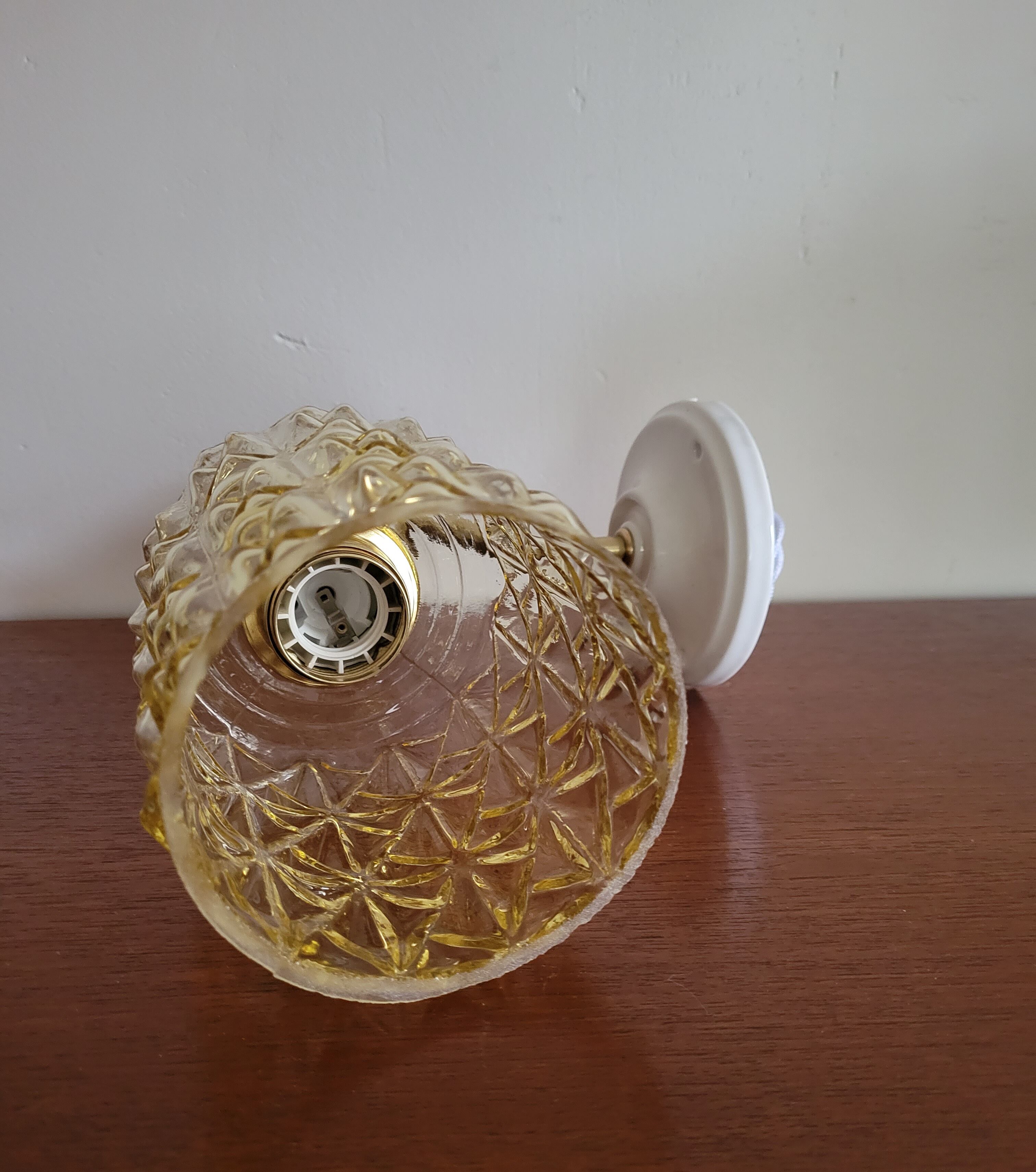 Brass wall lamp and molded glass