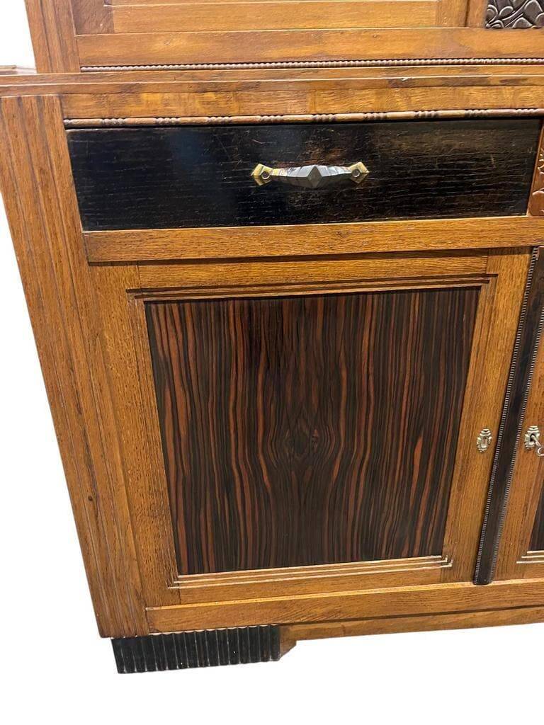 Vintage Art Deco display cabinet in wood with green stained glass.