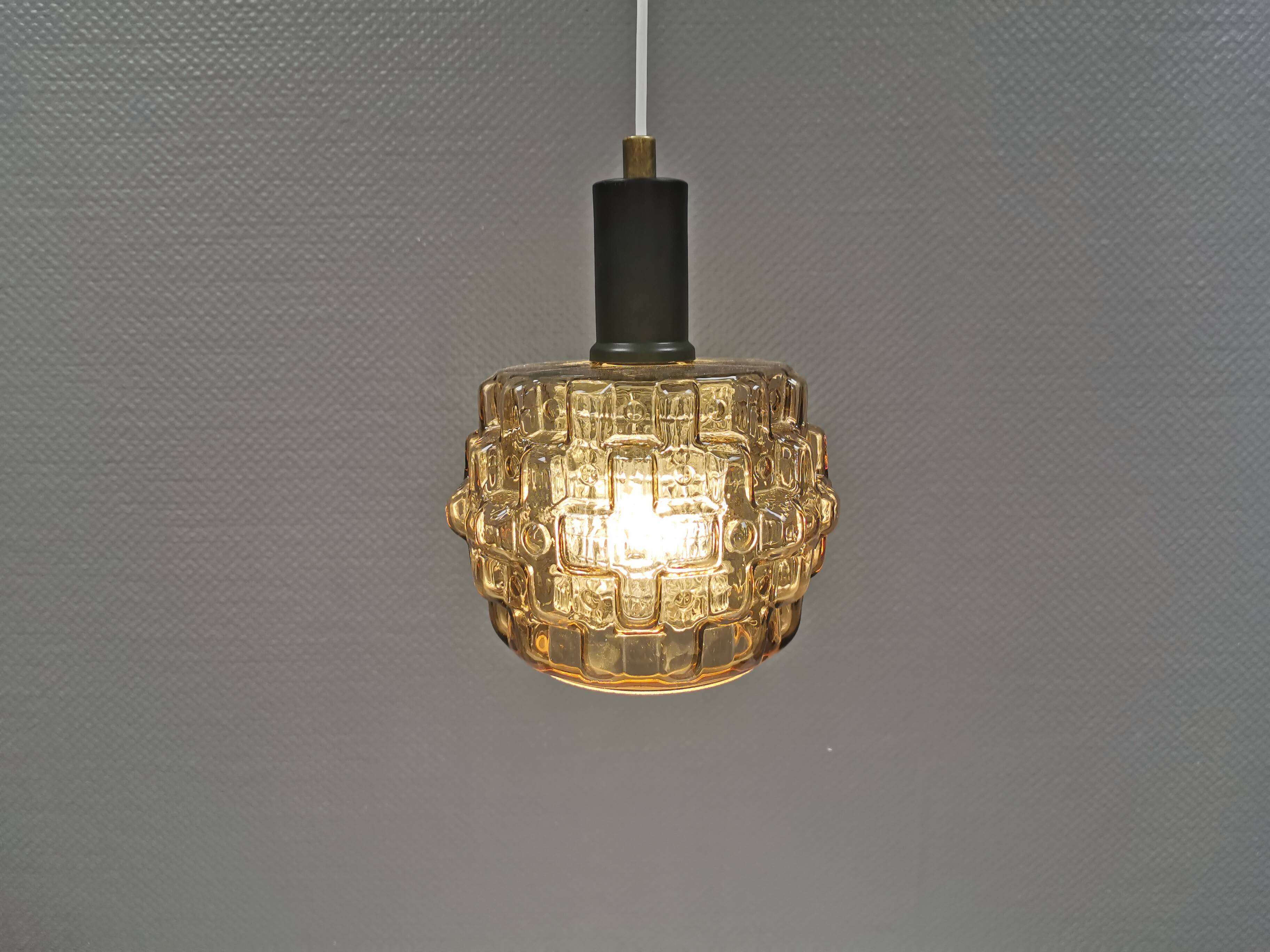 Older hanging lamp with champagne colored outer glass with inner shade of crystal glass.
