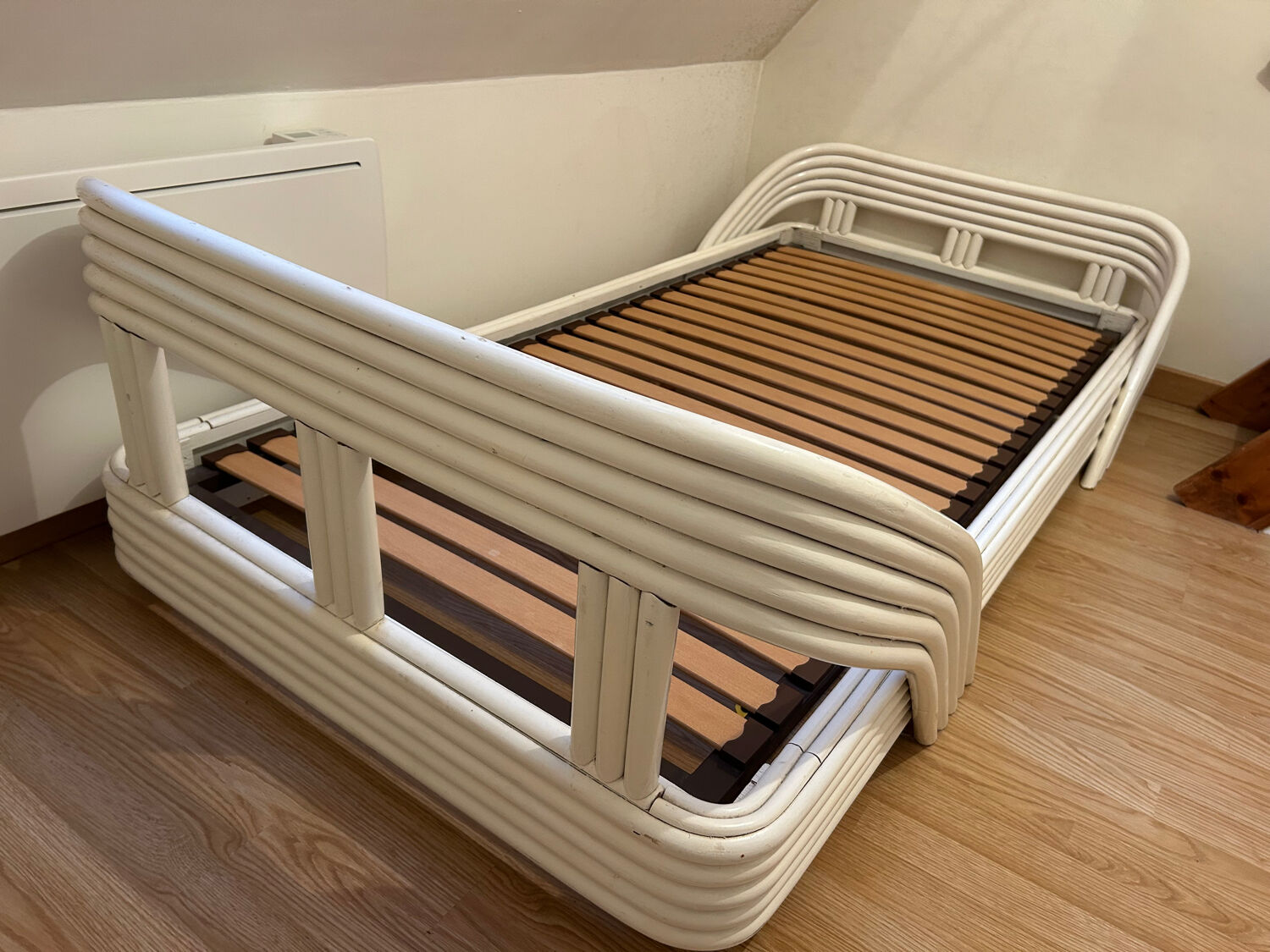 Vintage white rattan bed from the 1960s.