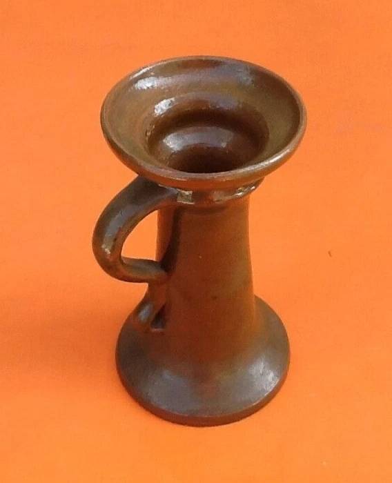 Varnished terracotta spool candlestick
