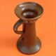 Varnished terracotta spool candlestick