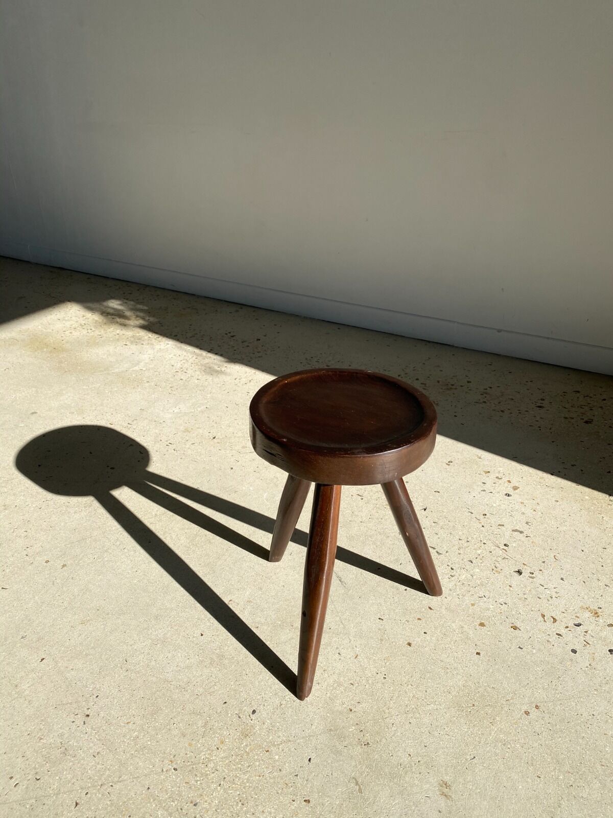 Brown solid wood stool seated circular dug