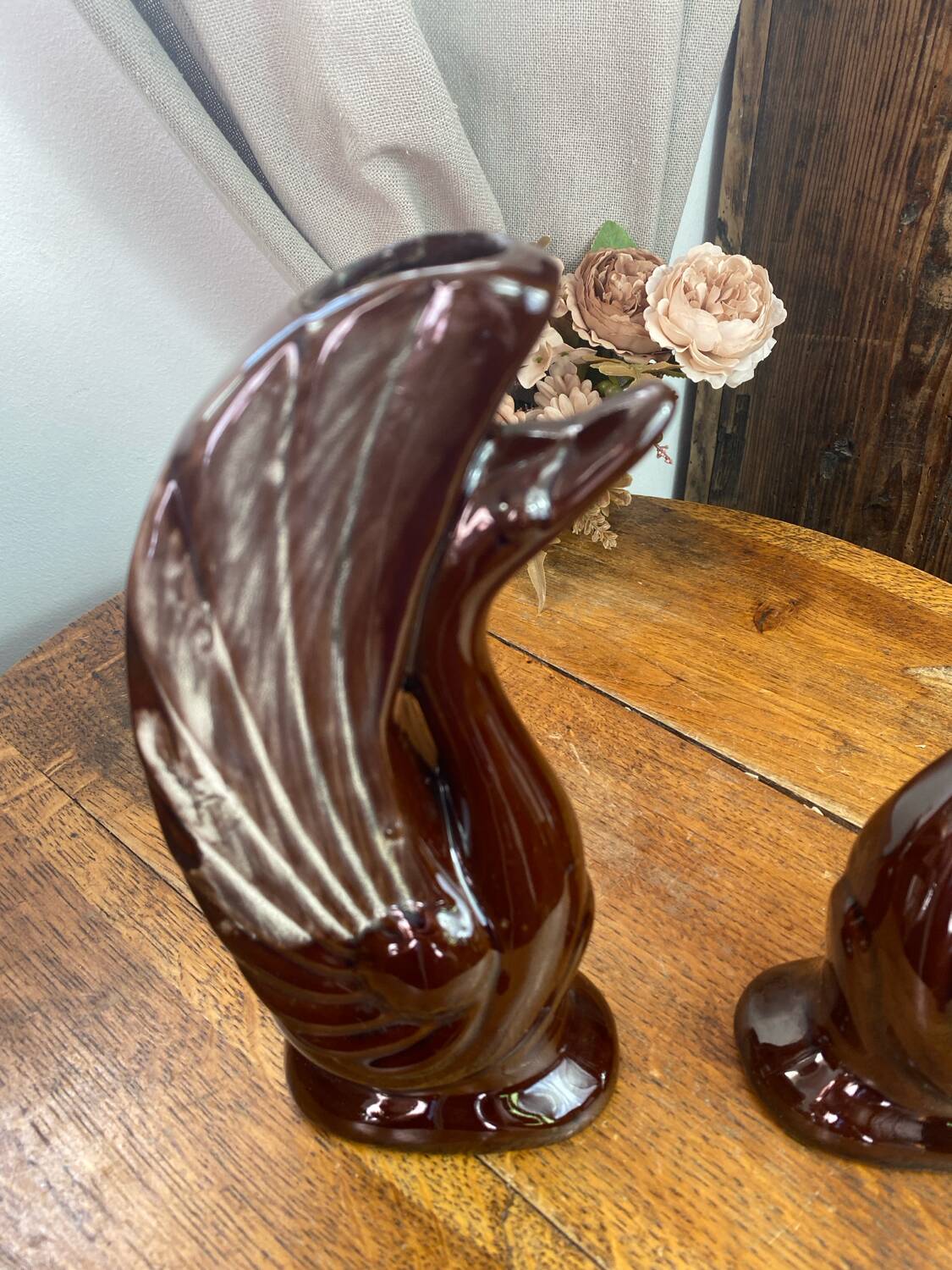 Pair of ceramic vases in the shape of swans.