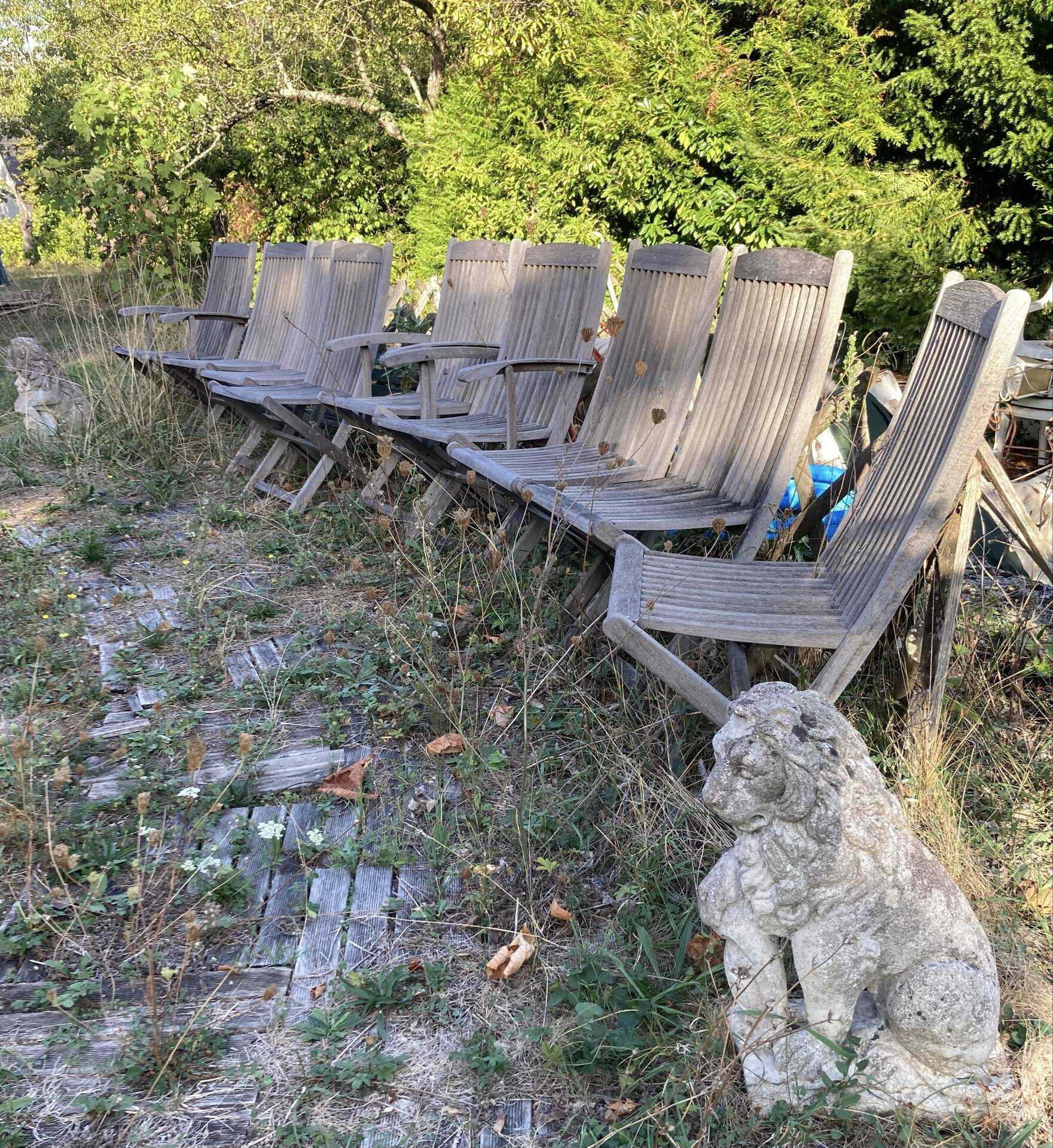 Folding garden chairs and armchairs in River Han dowelled teak.