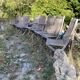 Folding garden chairs and armchairs in River Han dowelled teak.