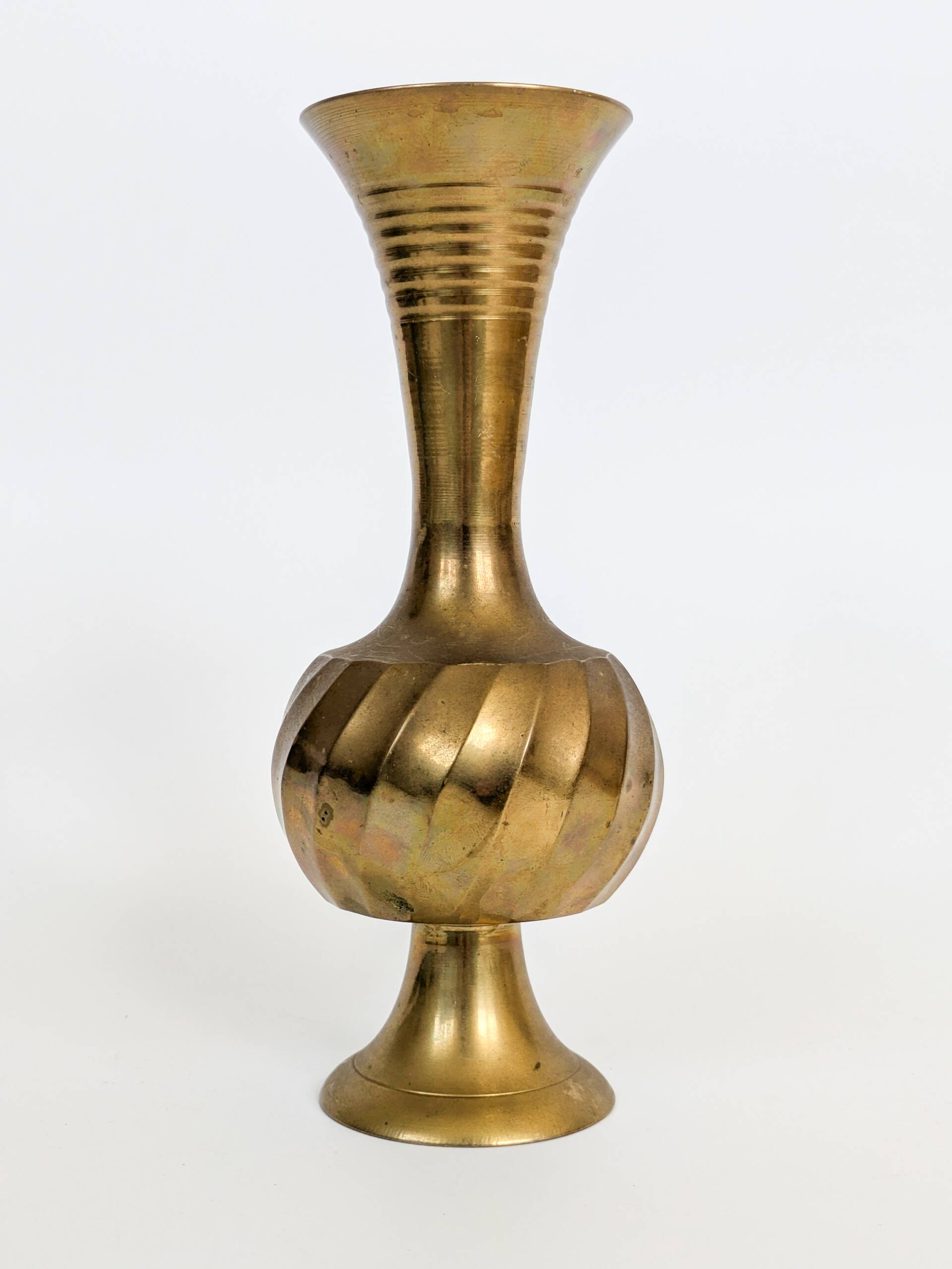 Solid brass Midcentury vase in trumpet shape with twisted details.