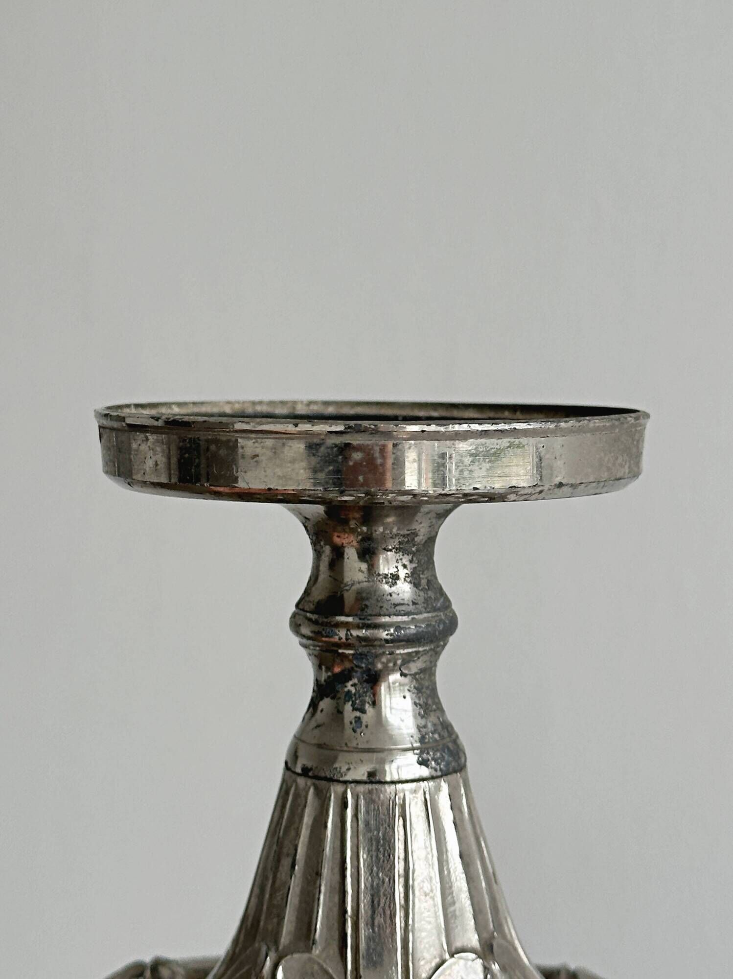 Candle holder with sculpted metal base, antique.