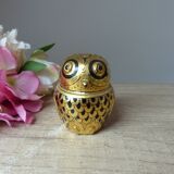 Old small black and gold lacquered wooden box in the shape of an owl