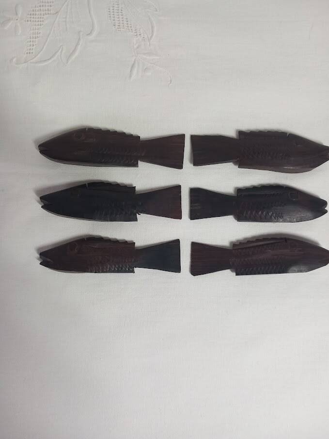 Antique wooden knife rests.