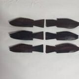 Antique wooden knife rests.