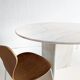 Round dining table in travertine from the 1980s.