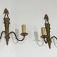 Pair of Louis XVI style bronze wall sconces with quivers and ribbons