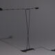 Floor lamp made from black painted metal with balancing arm