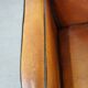 Sheep leather and wooden Art Deco design armchair with ball feet