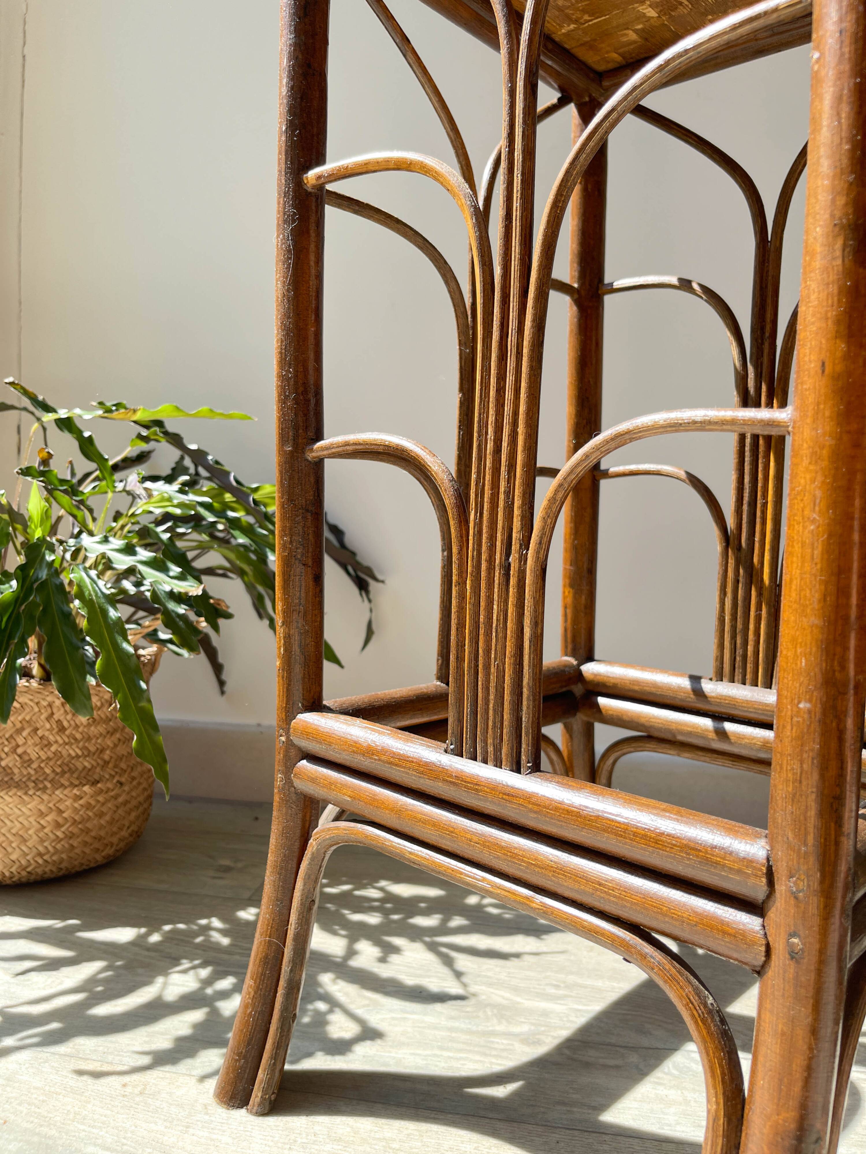 Vintage rattan plant stand in Art Deco style