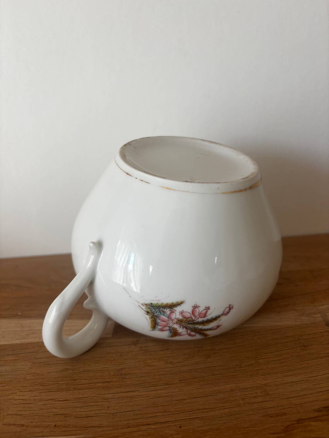 Beautiful vintage porcelain sugar bowl with a floral pattern.