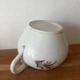 Beautiful vintage porcelain sugar bowl with a floral pattern.