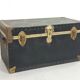 Old black trunk and brass