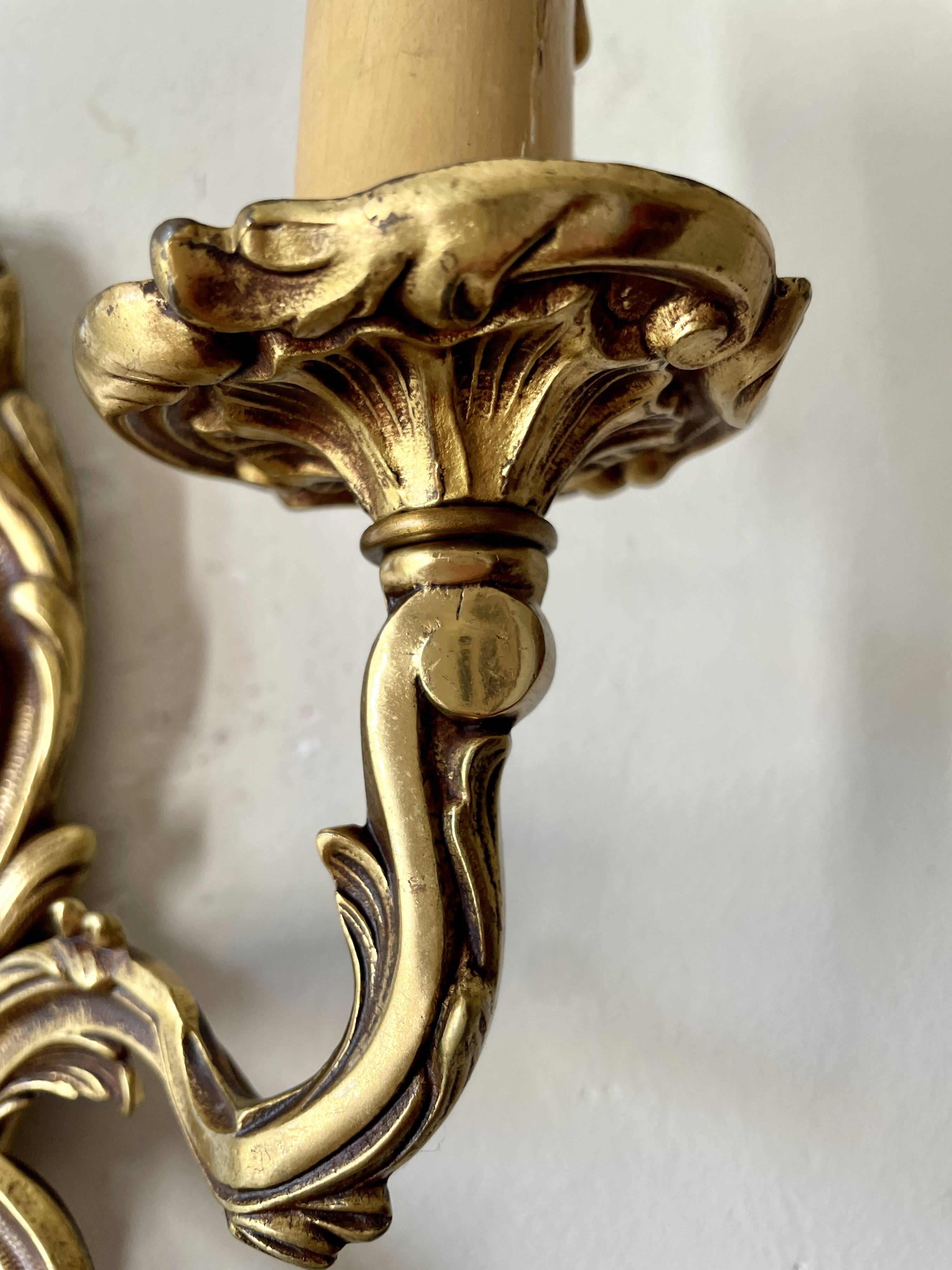Pair of rocaille bronze wall sconces