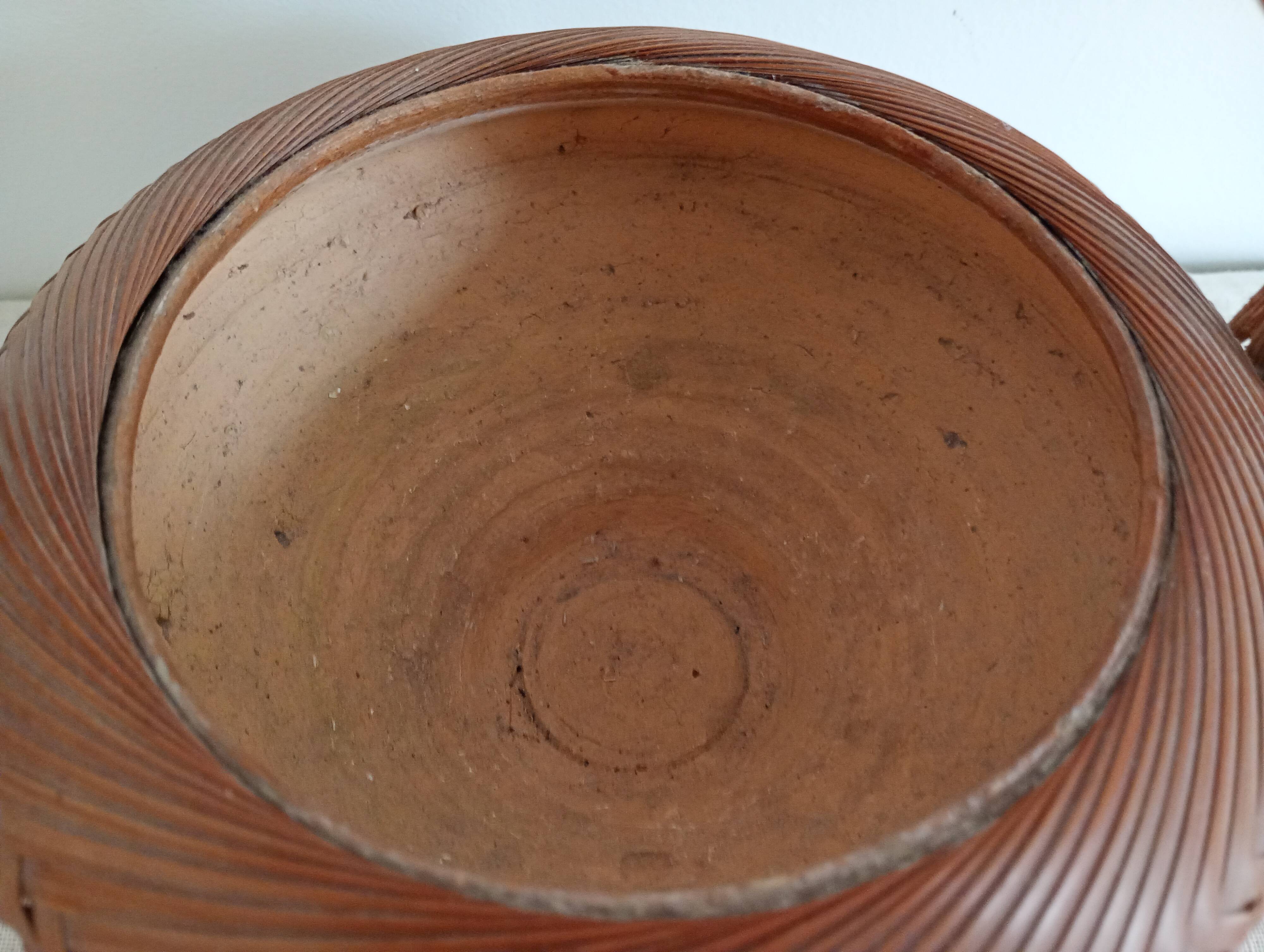 Woven bamboo basket and ceramic. Philippines.