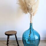 Small wooden tripod stool with turned legs, country style.