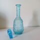 Old turquoise blue molded glass liqueur bottle and its cap
