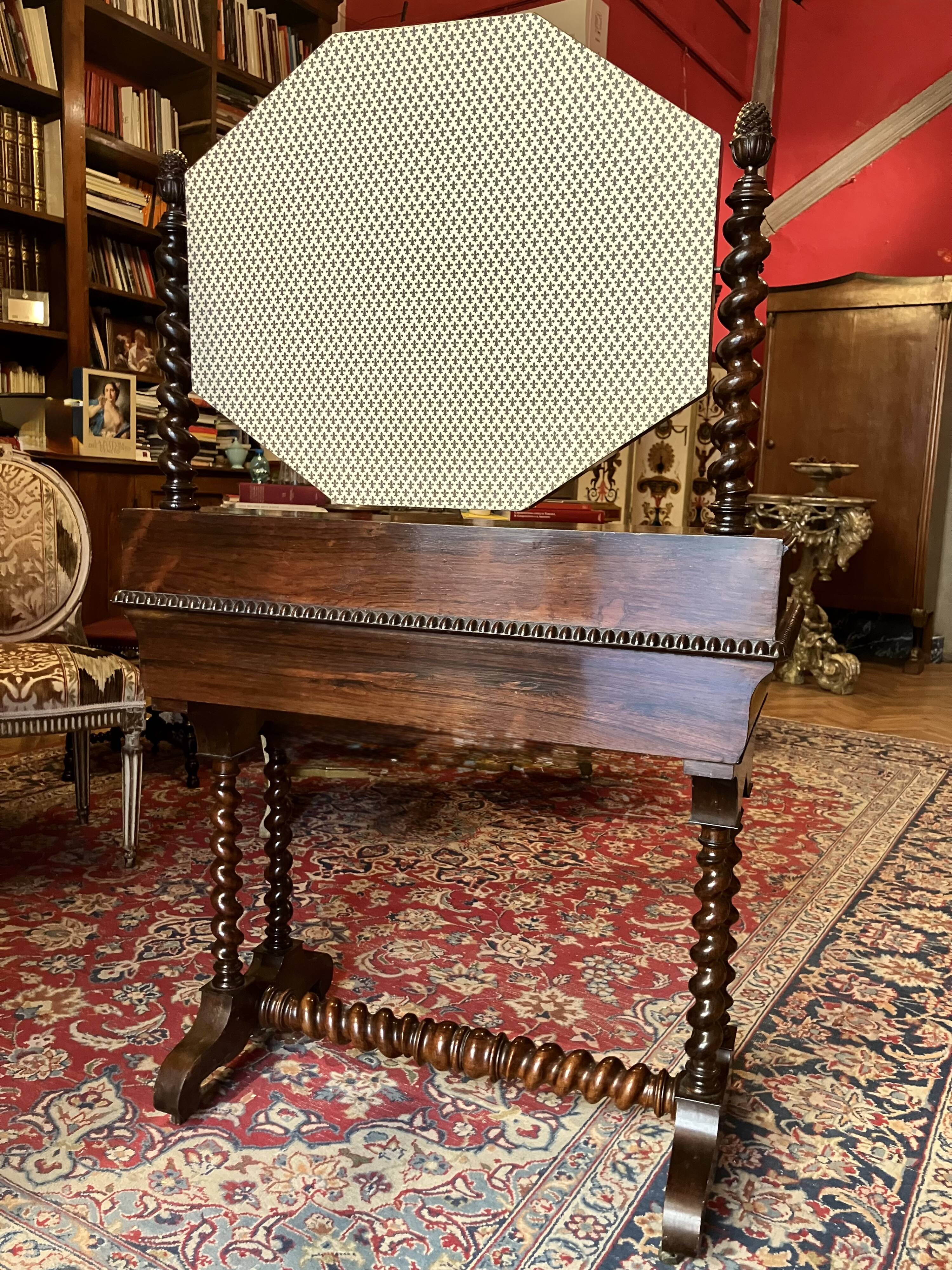 Antique English mahogany dressing table with carved details, black marble, and mirror.
