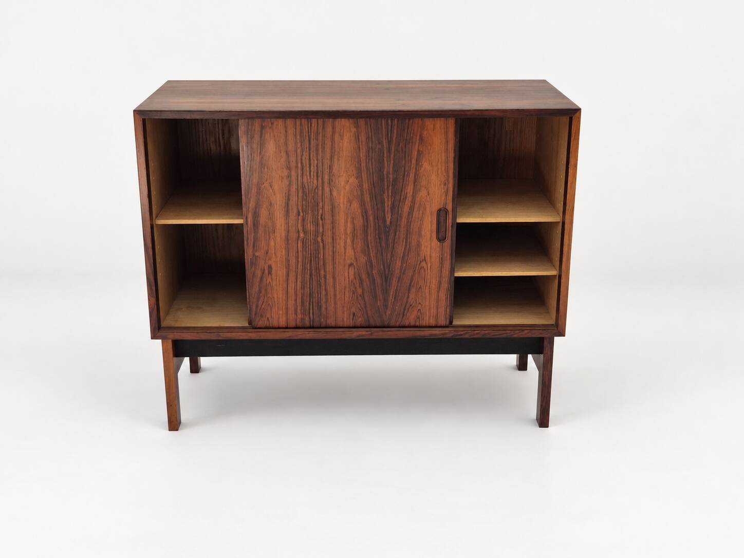 Low sideboard in rosewood with sliding doors. Denmark, 1960s