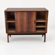 Low sideboard in rosewood with sliding doors. Denmark, 1960s