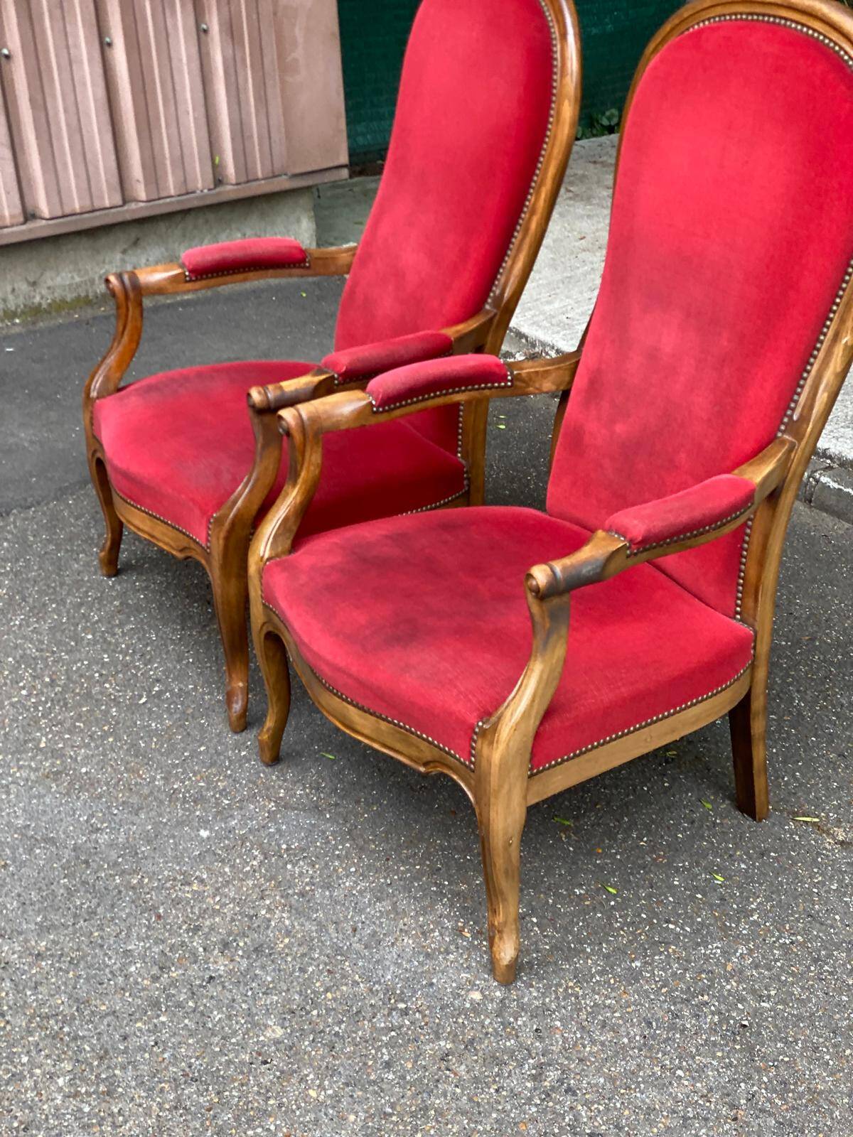 2 Louis Philippe cabriolet armchairs in burgundy velvet wood from the 19th century.