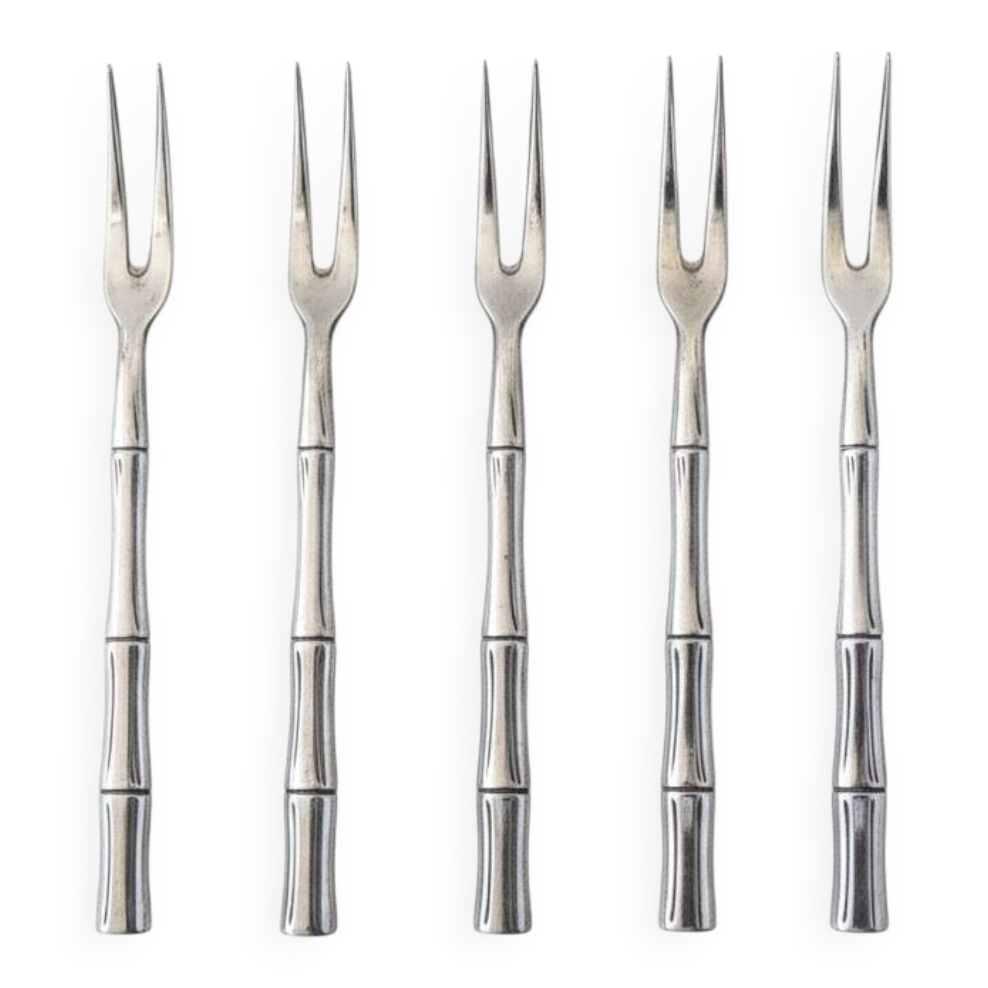Five silver-plated metal appetizer forks with bamboo-style handles