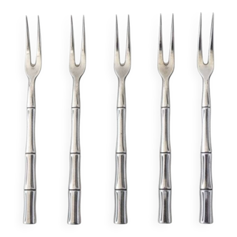 Five silver-plated metal appetizer forks with bamboo-style handles
