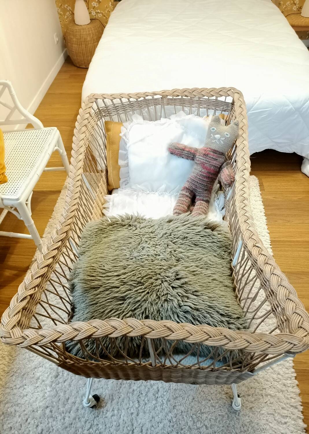 Rattan and wrought iron cradle