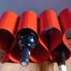 Red painted metal bottle holder, vintage 1980