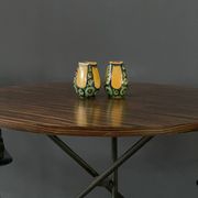 A pair of green and yellow vases